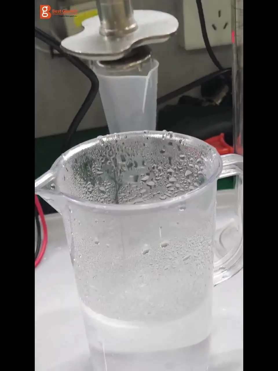 Connected dosing nozzle spraying into a collection container